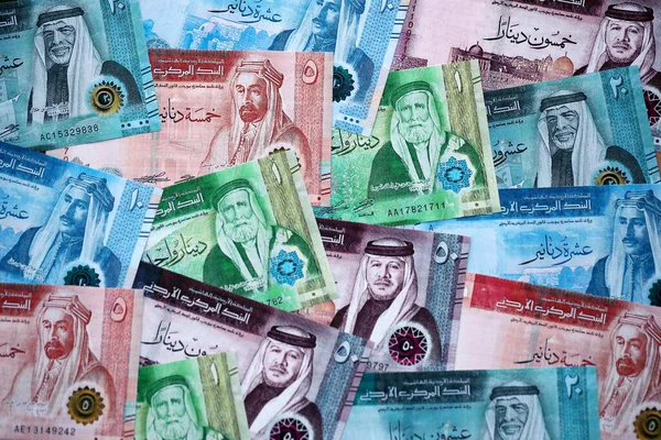Jordanian Dinar currency money bills. JOD currency banknotes in big amount with different denomination close up
