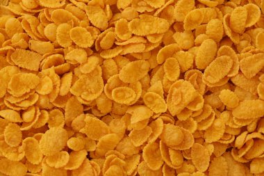 Mısır gevreği dokusu yakından geliyor. Sabah kahvaltısı için mısır gevreği kutusu.