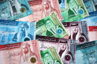 Jordanian Dinar currency money bills. JOD currency banknotes in big amount with different denomination close up