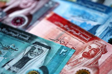 Jordanian Dinar currency money bills. JOD currency banknotes in stack with different denomination close up