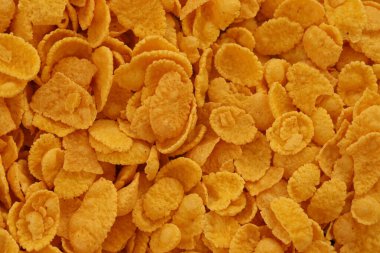 Mısır gevreği arkaplanı ve dokuyu kapatır. Sabah kahvaltısı için mısır gevreği kutusu.