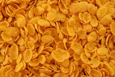 Mısır gevreği arkaplanı ve dokuyu kapatır. Sabah kahvaltısı için mısır gevreği kutusu.