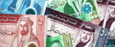 Jordanian Dinar currency money bills. JOD currency banknotes in big amount with different denomination close up