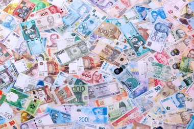 Dünyanın farklı ülkelerinden, farklı mezheplerden pek çok banknot. Çeşitli para birimlerinin büyük miktarları. Döviz Borsası kavramı