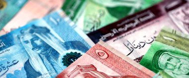 Jordanian Dinar currency money bills. JOD currency banknotes in big amount with different denomination close up