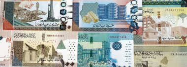 Sudan 'ın kağıt banknotları masanın üstüne yığılmış. Sudan SDG para birimi faturaları büyük miktarda. Sudan 'da ekonomi, vergi ve bankacılık kavramı