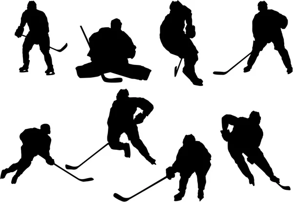 Set of hockey player silhouettes — Stock Vector