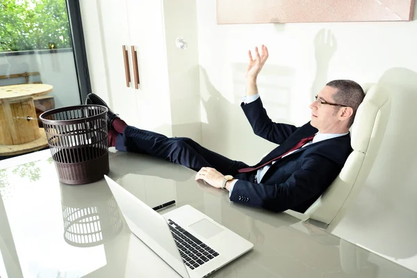 business man play basket ball in office