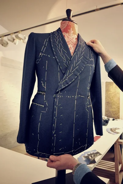 Tailor verify bespoke suit Stock Photo