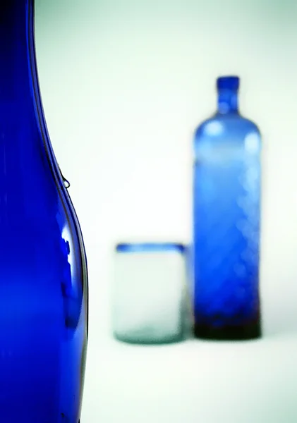 Water drop on blue bottle - concept — Stock Photo, Image