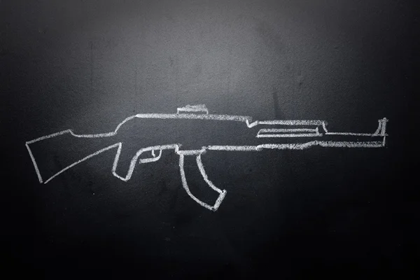 Weapon draw erased on blackboard - no violence concept — Stock Photo, Image