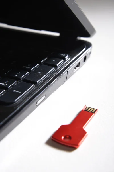 red usb key on black keyboard