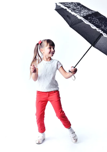 Kleines Mädchen mit einem Regenschirm — Stockfoto