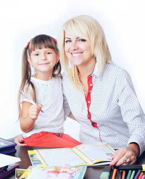 Little girl draws a teenage student decides to write homework wi — Stock Photo, Image