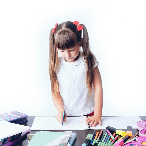 Little girl draws a teenage student decides to write homework wi — Stock Photo, Image