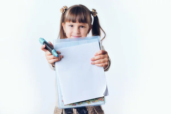 Portrait of teenager girl with school backpack holding colored folders isolated on white background — Stock Photo, Image