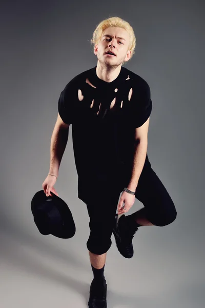 Male Model blond in hat posing in studio — Stock Photo, Image