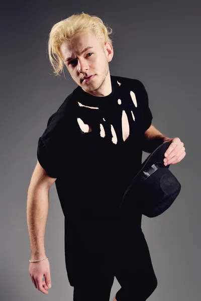 Male Model blond in hat posing in studio — Stock Photo, Image