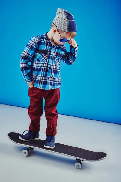 Happy boy riding skateboard