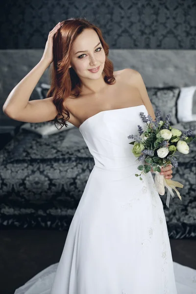 Portrait of the beautiful bride against a window indoors — Stock Photo, Image