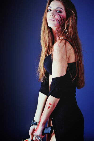 zombie girl with an ax. scars on the body with blood.