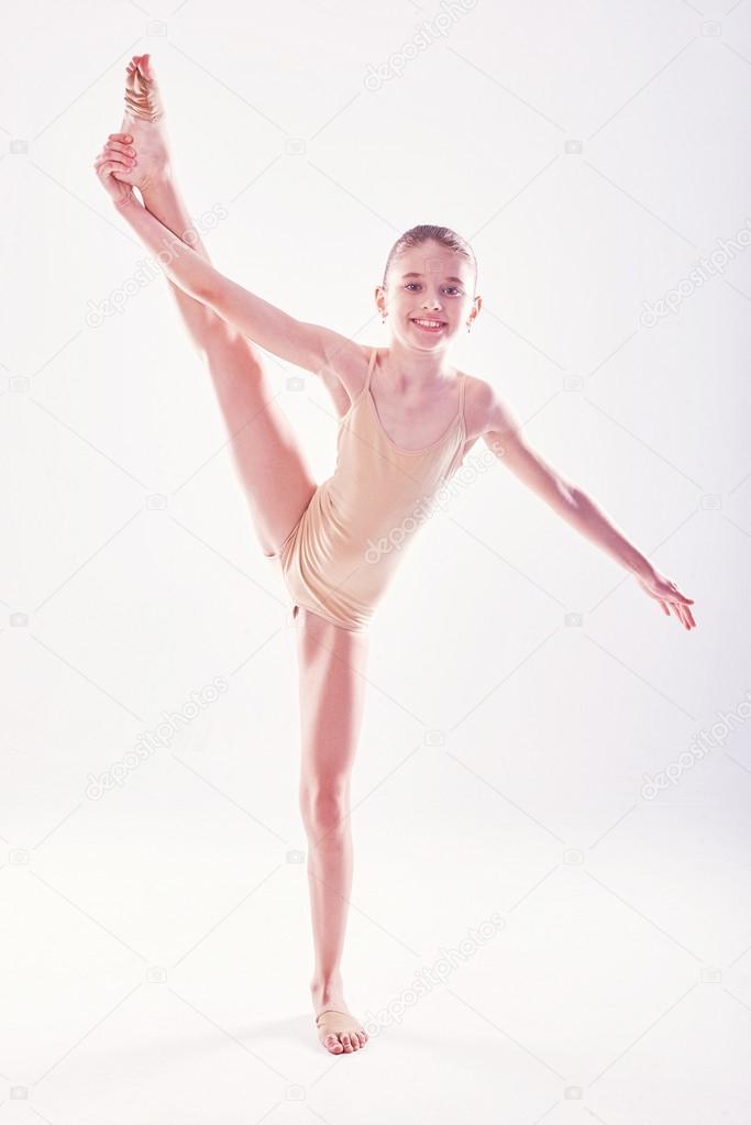 little girl acrobat. exercises. fitness