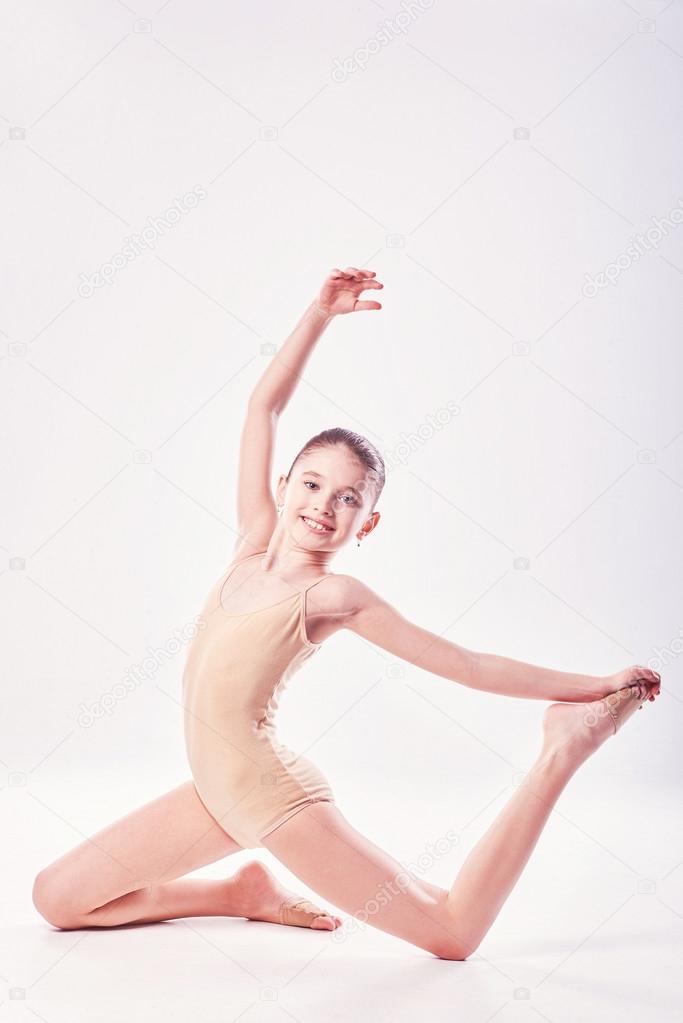 little girl acrobat. exercises. fitness