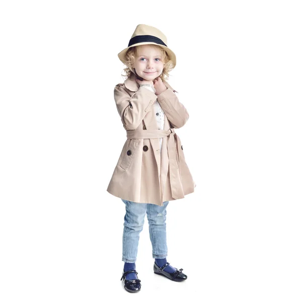 Fashionable child. Blonde girl in a stylish raincoat and hat. — Stock Photo, Image