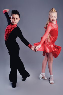 Two beautiful children dancing ballroom dance sport clipart