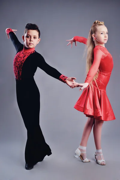 Two beautiful children dancing ballroom dance sport