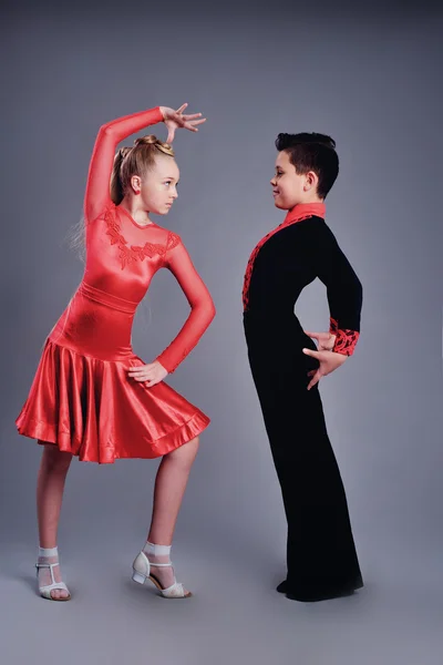 Two beautiful children dancing ballroom dance sport