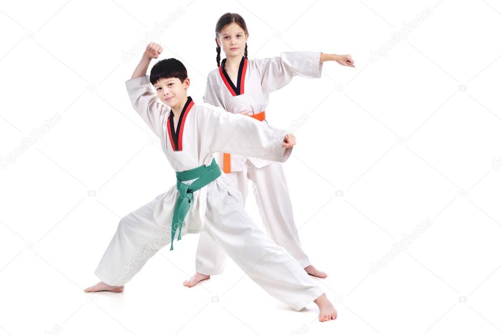 Two children athletes martial art taekwondo training
