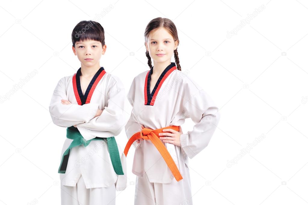 Two children athletes martial art taekwondo training