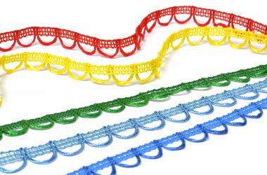 Curved strips of multicolored lace on white background clipart