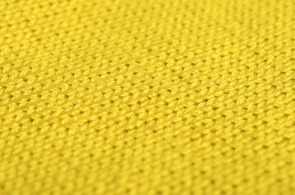 Piece of knitting work - yellow yarn stitches - macro — Stock Photo, Image