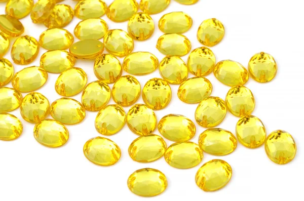 Yellow rhinestone on white background — Stock Photo, Image