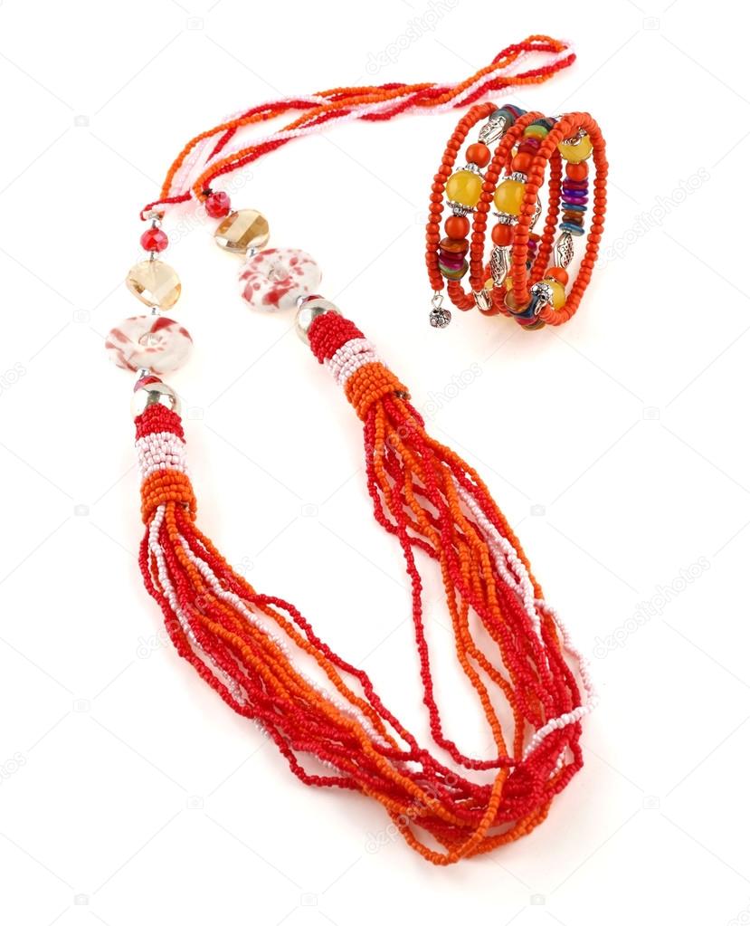 Orange ethnical fashion jewelry on white background