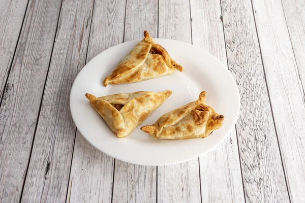 Three Unclosed Argentine Beef Empanadas White Plate White Wooden Table — Stock Fotó