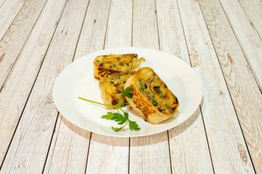 Snail, potato and mushroom stew rolled up with a wheat tortilla and cooked on the grill