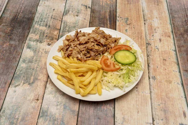 Kebab Plate Garnished Fried Potatoes Roast Lamb Meat Iceberg Lettuce — Stock Photo, Image