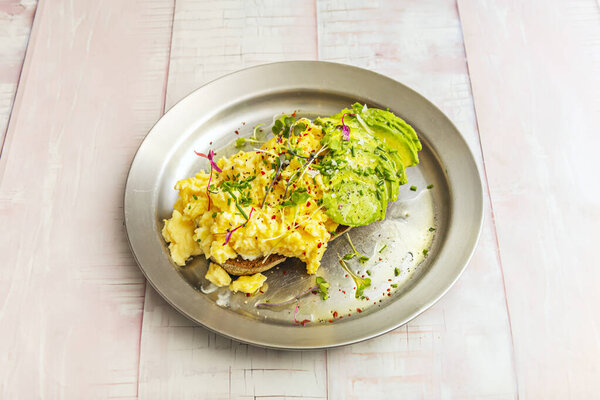 Classic croissant filled with a French omelet, fresh chives, and high-quality Norwegian smoked salmon