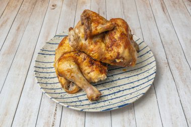 a revealing image shows how thin sheets of herb butter were slipped between the skin and the meat, ensuring that every inch is fragrant and succulent
