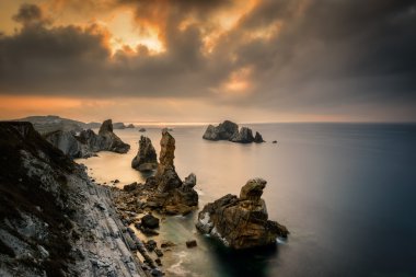 Liencres rocks on coast in Spain clipart