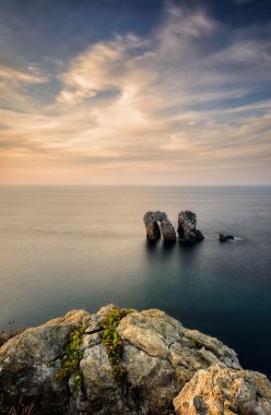Liencres rocks on coast in Spain clipart