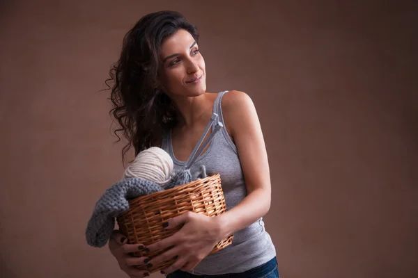 Basket witn yarn ball and knitting needles in woman hands — Stock Photo, Image