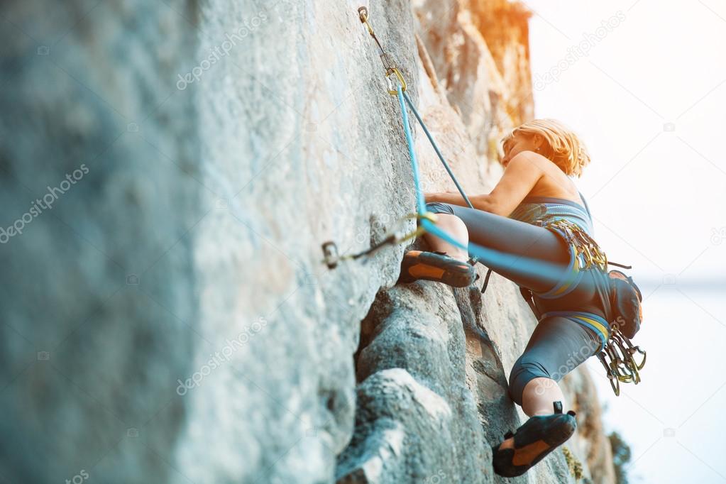 Rock climbing on vertical flat wall - Stock image