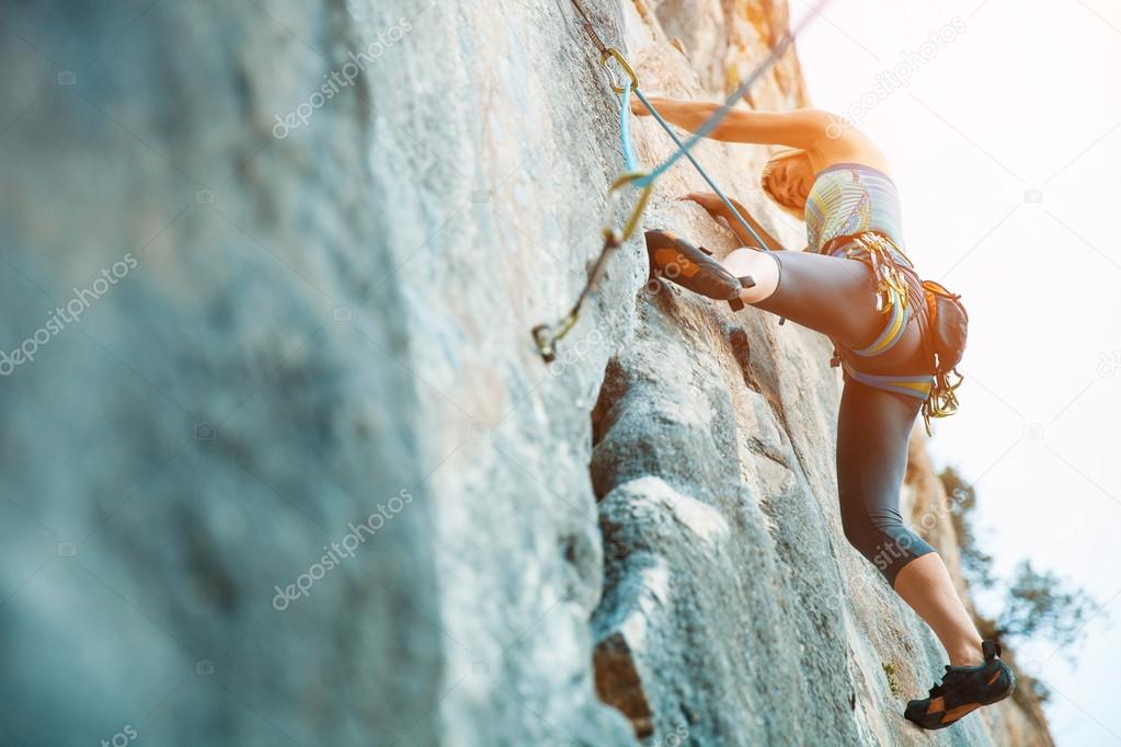 Rock climbing on vertical flat wall - Stock image