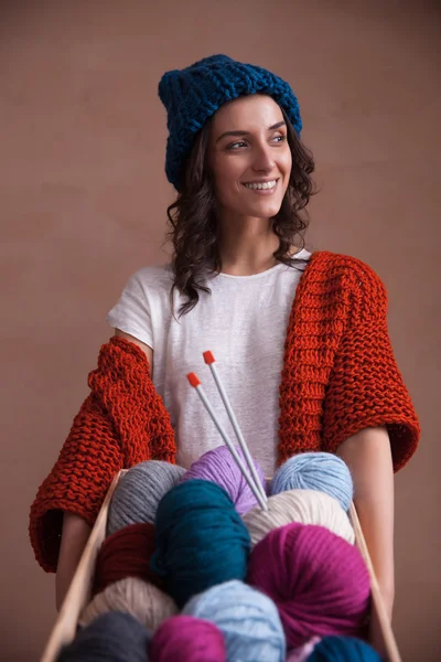 Box witn yarn balls knitting and needles in woman hands — Stock Photo, Image