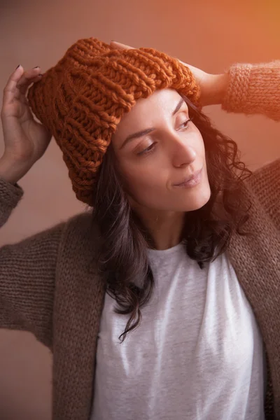 Happy smiling woman in knitted hat