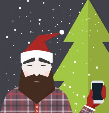 Noel Baba akıllı telefon tutar gibi giyinmiş adam